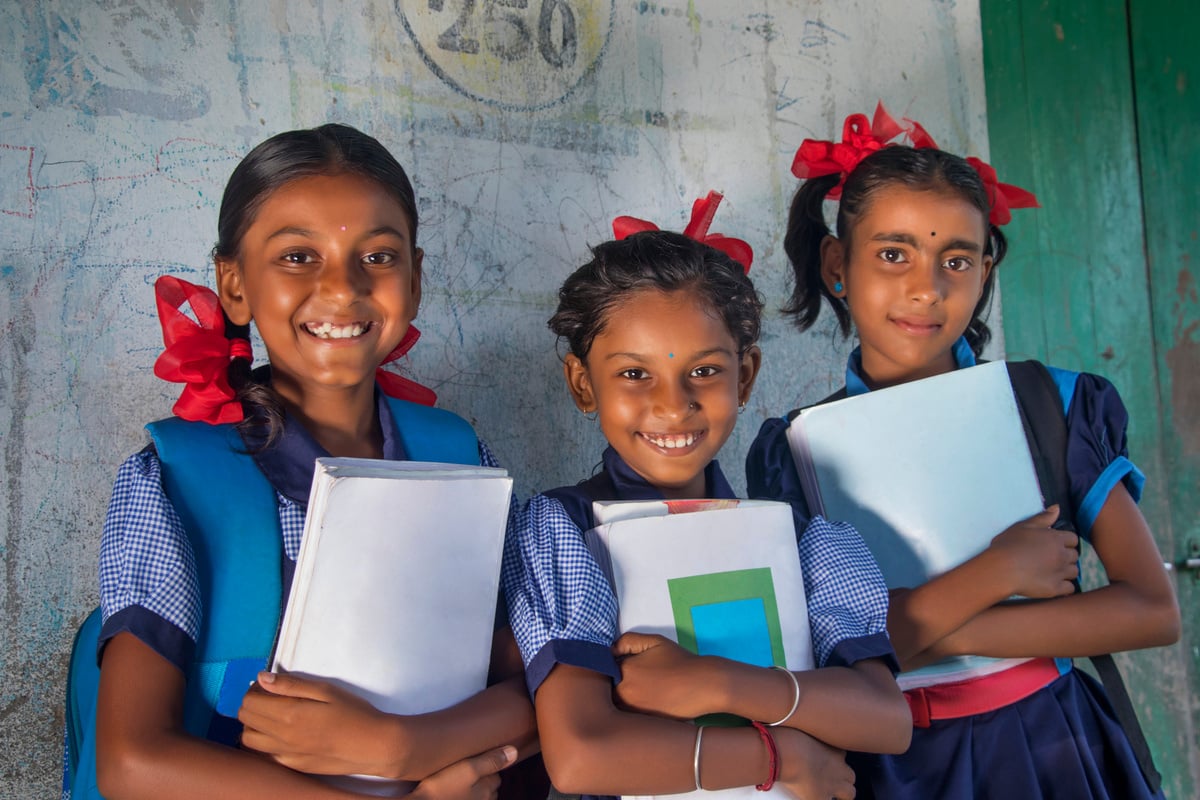 Indian Rural School Girls Holding Books Standing in School